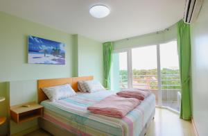 Cama ou camas em um quarto em Baan Ruen Rom By Antonsen