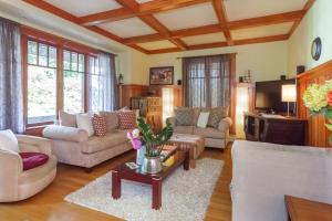 a living room with couches and a table at Beautiful, Quiet 3BR in Posh Kitsilano in Vancouver