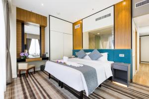 Uma cama ou camas num quarto em Eco Tree Hotel Causeway Bay