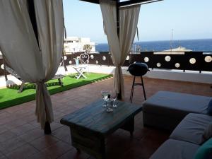a living room with a table and glasses of wine at Casa Trini in La Mareta +39 photos