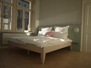 מיטה או מיטות בחדר ב-ZeitRaum10