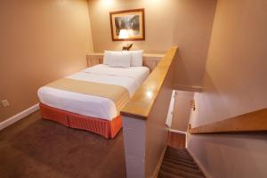 a hotel room with a bed and a desk at Legacy Vacation Resorts Steamboat Springs Hilltop in Steamboat Springs