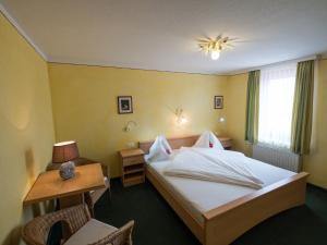 Кровать или кровати в номере Kutscherklause