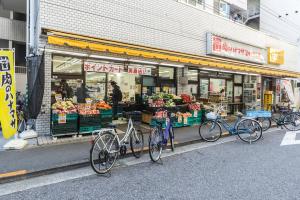 a group of bikes parked in front of a store at Ikebukuro Yamase Building #GR1 in Tokyo