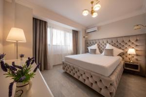 Postel nebo postele na pokoji v ubytování Hotel Casa Fiori