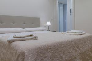 Postel nebo postele na pokoji v ubytování Majoorel (near San Marco)