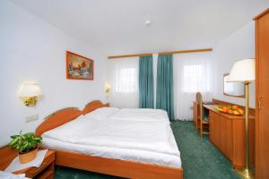 Posteľ alebo postele v izbe v ubytovaní Hotel Spindlerova Bouda