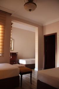 Voodi või voodid majutusasutuse Adrasan La Casita Hotel toas