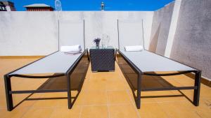 two ping pong tables on a tennis court at Wonderful penthouse in the center of Icod de los Vinos in Icod de los Vinos