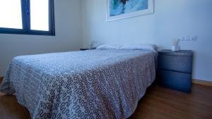 Кровать или кровати в номере Wonderful penthouse in the center of Icod de los Vinos