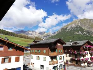 a view of the mountains from the balcony of a hotel at Garni Delia in Livigno