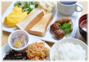 a white tray with different types of food on it at Tourist Hotel Hitachi in Hitachi