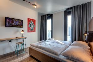 Postel nebo postele na pokoji v ubytování MEININGER Hotel Berlin Tiergarten