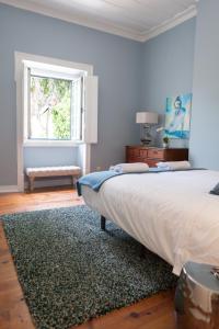 a bedroom with a large bed and a window at Eighteen21 Houses - Casa de São Domingos in Lisbon