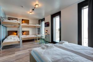 Postel nebo postele na pokoji v ubytování MEININGER Hotel Berlin Tiergarten