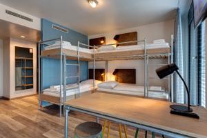 Postel nebo postele na pokoji v ubytování MEININGER Hotel Berlin Tiergarten