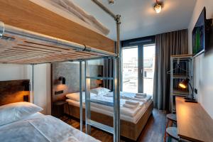 Postel nebo postele na pokoji v ubytování MEININGER Hotel Berlin Tiergarten