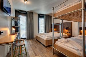 Postel nebo postele na pokoji v ubytování MEININGER Hotel Berlin Tiergarten