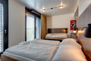 Postel nebo postele na pokoji v ubytování MEININGER Hotel Berlin Tiergarten