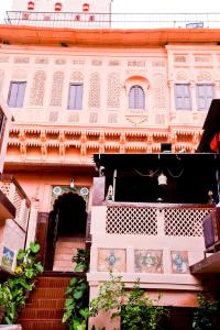 a building with a staircase in front of it at Singhvi's Haveli in Jodhpur