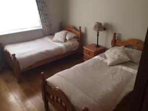 Łóżko lub łóżka w pokoju w obiekcie Flushing Meadows