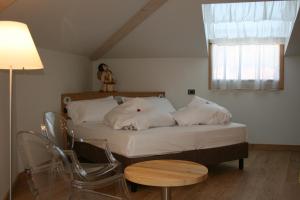 Кровать или кровати в номере Hotel Orso Grigio