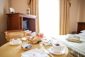 Posteľ alebo postele v izbe v ubytovaní Excelsior Palace Hotel