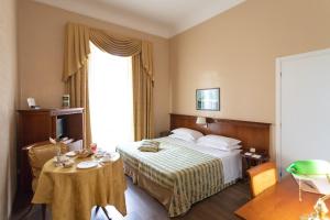 Posteľ alebo postele v izbe v ubytovaní Excelsior Palace Hotel
