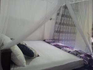 Ένα ή περισσότερα κρεβάτια σε δωμάτιο στο Ami place Rooms with Kitchen