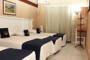 Cama ou camas em um quarto em Hotel Solar do Imperador