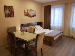 Postel nebo postele na pokoji v ubytování Sweet Apartment New Gudauri suites + 10 fotografií