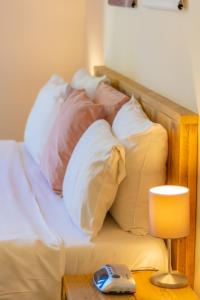 Łóżko lub łóżka w pokoju w obiekcie Boutique Hotel 't Klooster