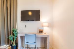 Telewizja i/lub zestaw kina domowego w obiekcie Boutique Hotel 't Klooster