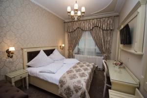 Llit o llits en una habitació de Vila Turistica Tosca Regal