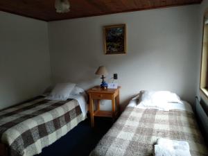Rúm í herbergi á Hotel Mi Casa