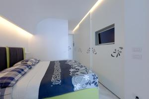 Posteľ alebo postele v izbe v ubytovaní Boutique House Fiò