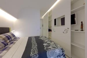 Posteľ alebo postele v izbe v ubytovaní Boutique House Fiò