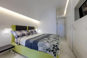 Posteľ alebo postele v izbe v ubytovaní Boutique House Fiò