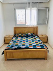 Tempat tidur dalam kamar di Safiote House appartement