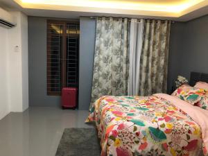 a bedroom with a bed and a window at *3BR/*3Bath Fully Furnished Town House - BICOL in Naga