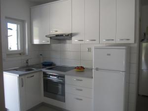 Kuchyň nebo kuchyňský kout v ubytování Apartments Kuzmanic