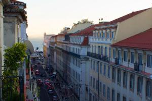 a view of a city street with buildings at Apartment Baixa/Chiado view Castle in Lisbon
