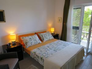 Postel nebo postele na pokoji v ubytování Apartments Kuzmanic