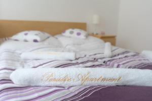 Posteľ alebo postele v izbe v ubytovaní Paradise Apartment