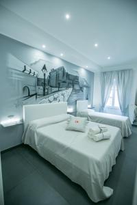 Postel nebo postele na pokoji v ubytování Benvenuti al Sud Naples