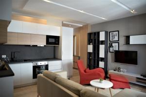 a living room with a couch and a table at Haris Apartment Tirana no.2 in Tirana