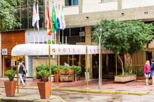 a store with flags in front of a building at Hotel Vermont Ipanema in Rio de Janeiro