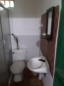 a bathroom with a toilet and a sink at Mi Casa en Barichara in Barichara +33 photos