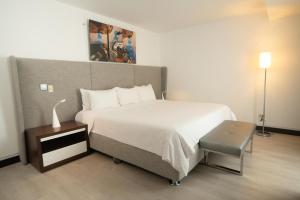 Ein Bett oder Betten in einem Zimmer der Unterkunft Radisson Hotel Decapolis Miraflores