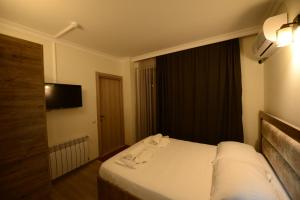 Postel nebo postele na pokoji v ubytování Hotel Aristocrat Batumi